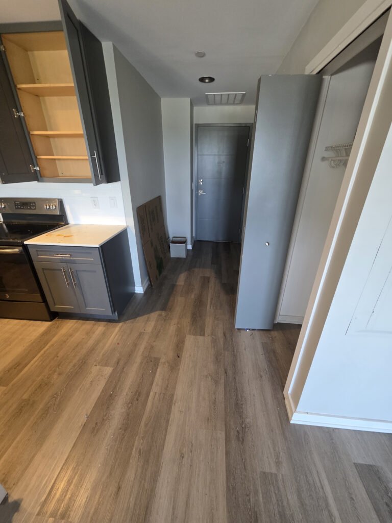 Apartment hallway and kitchen after cleaning