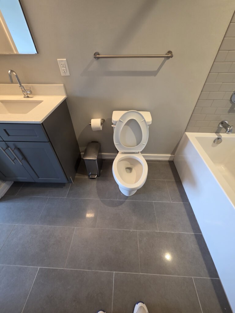 Clean bathroom with toilet and vanity